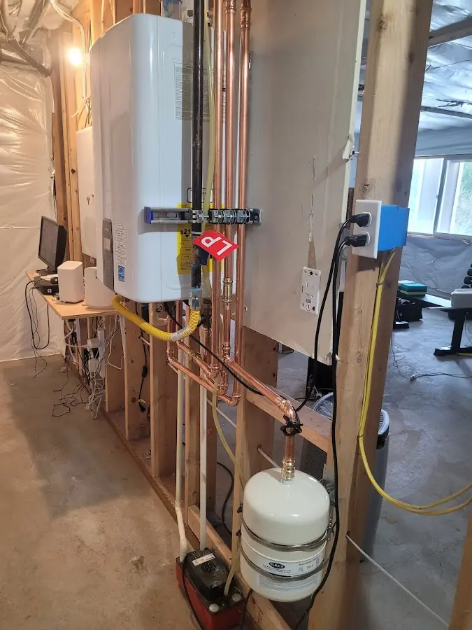 Licensed plumber repairing a kitchen sink in Johnson